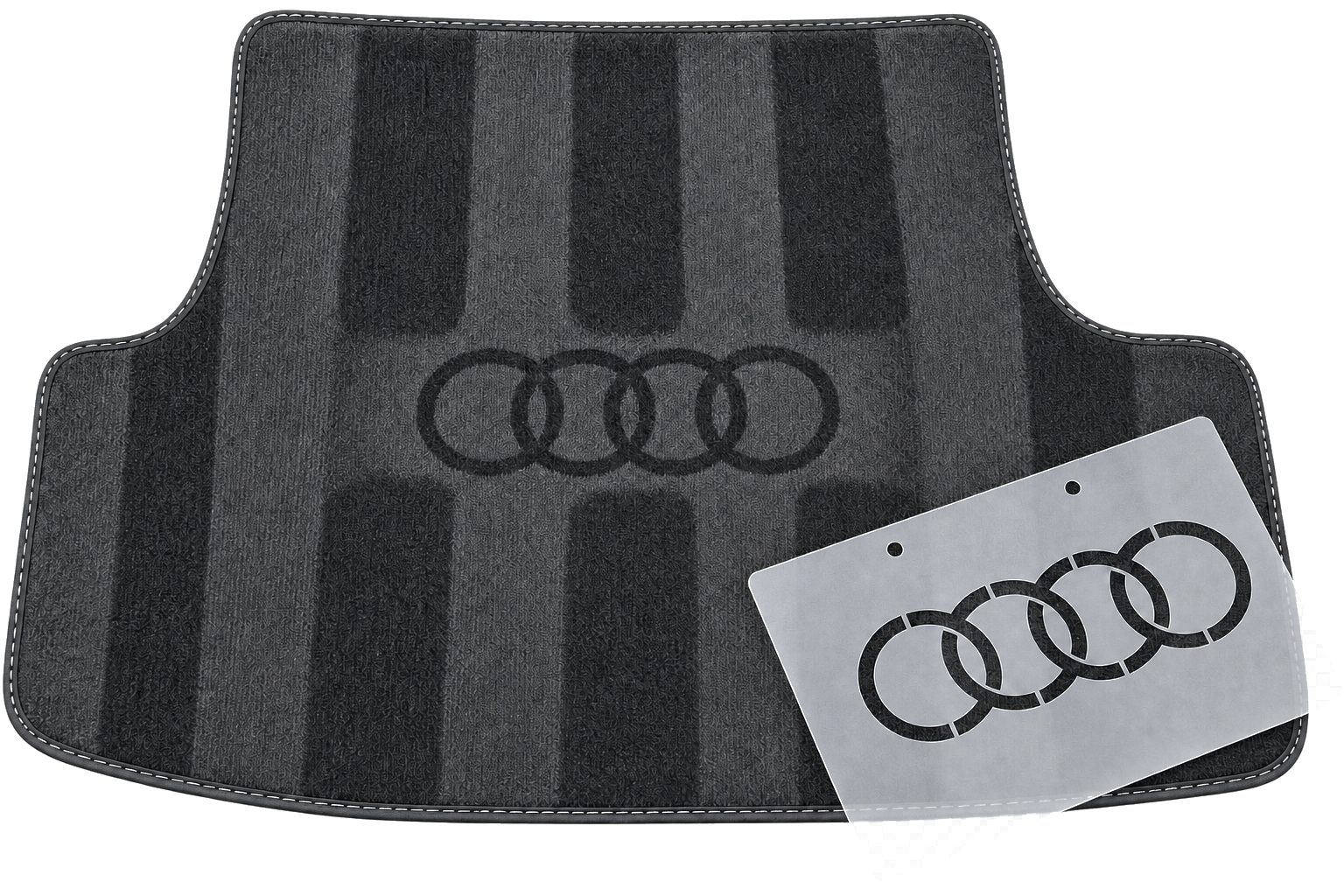Audi stencil beside its finished logo effect on a detailed car mat